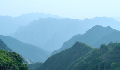 View of misty fog mountains in summer