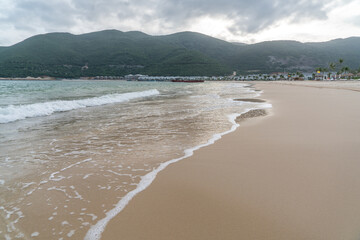 beach sea sky and mountain