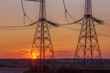 High voltage power line at sunset.