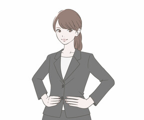 両手を腰にそえるスーツを着た女性