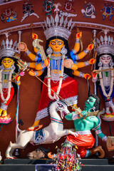 Idol of Goddess Devi Durga at a decorated puja pandal in Kolkata, West Bengal, India. Durga Puja is...