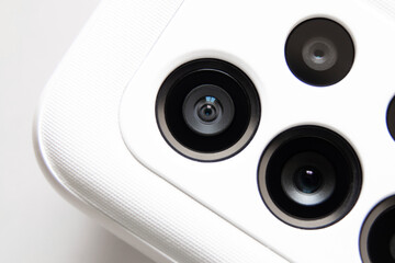 The camera on the phone and a white case close-up, macro photo and new technologies