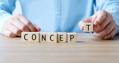 Businessman hand holding wooden cubes, with concept word, business concept