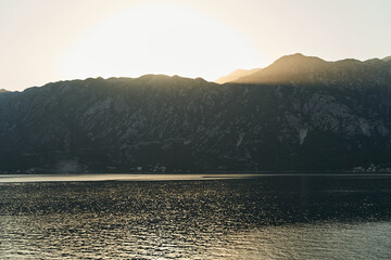 View of the sunset in Boko-Kotor Bay in Montenegro. Silhouettes of mountains
