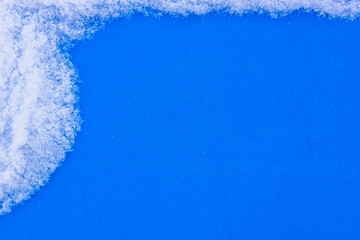 Blue table background in snow (copy space).
