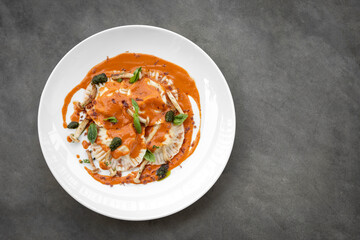vegan mixed vegetable ravioli pasta with tomato and pumpkin sauce