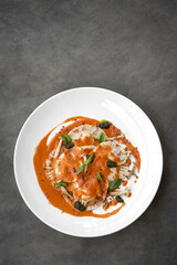 vegan mixed vegetable ravioli pasta with tomato and pumpkin sauce