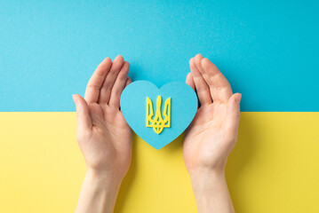 Stop the war in Ukraine concept. First person top view photo of young woman's hands demonstrating...