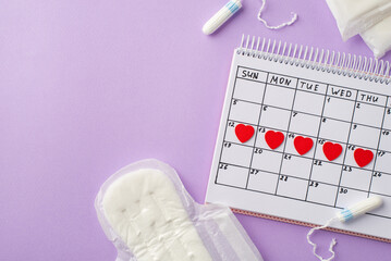 Top view photo of red heart marks on the calendar sanitary napkins and tampons on isolated pastel violet background with copyspace