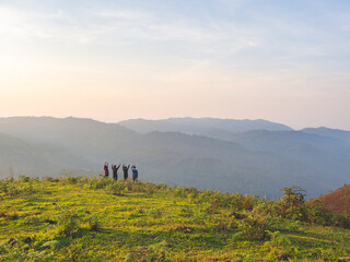 Fototapeta na wymiar Trekking group enjoying on mountain trail in tropical forest at Tak Province, Thailand.