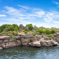 Fototapeta na wymiar summer river flow among stony coast at summer day