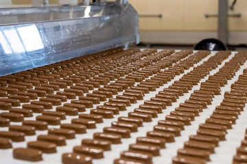 Naklejka premium Production of chocolate bars. Confectionery factory.