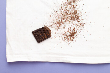 white clothes with ditry stains from chocolate on purple very peri background