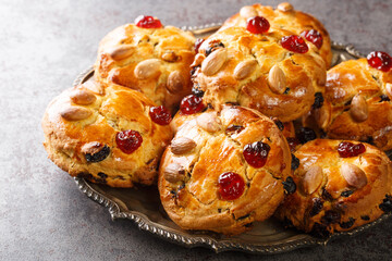 Authentic Yorkshire Fat Rascals scones with dried fruits and almonds close-up in a plate on the table. horizontal