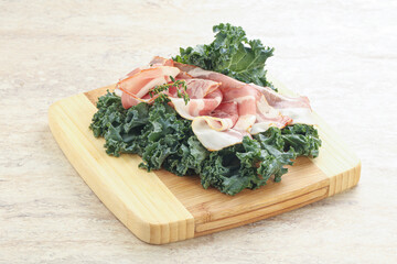 Raw pork bacon over board