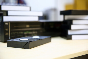 Pile of video cassette tape VHS with video playback old retro style stack concept of vintage...