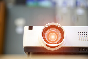 Close-up computer projector on table boardroom or meeting room technology equipment of visual or...