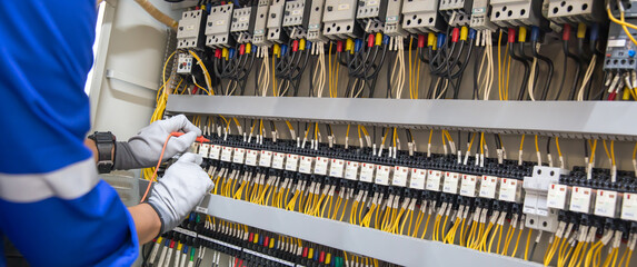Electricity and electrical maintenance service, Engineer hand holding AC voltmeter checking...