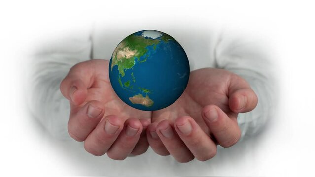 united hands protecting the world from conflicts, caring for the environment, maintaining the union between all. Elements of this image furnished by NASA