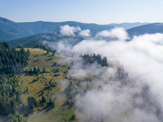 Morning fog in the Ukrainian Carpathians. Aerial drone view.