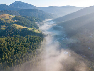 Morning fog in the Ukrainian Carpathians. Aerial drone view.