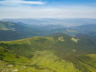 Fototapeta premium High mountains of the Ukrainian Carpathians in cloudy weather. Aerial drone view.