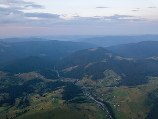 Sunset over the mountains in the Ukrainian Carpathians. Evening. Aerial drone view.