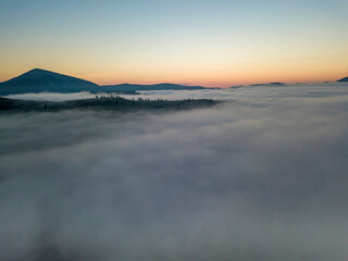 Morning fog in the Ukrainian Carpathians. Aerial drone view.