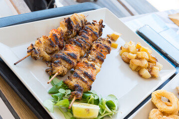 Fish skewers in the dish