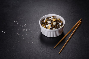 Far Eastern salad - sea kale with egg in a white cup top