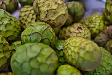 Macro shot of Cherimoya fruits. The cherimoya is scientifically named Annona Cherimola on the market in Funchal, Madeira, Portugal