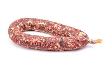 Dry cured pork sausage ring isolated on white