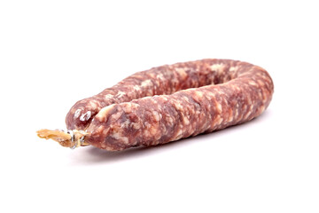 Dry cured pork sausage ring isolated on white