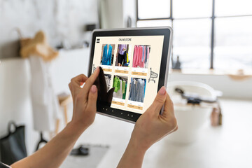 Fototapeta na wymiar Woman using digital tablet to shop online