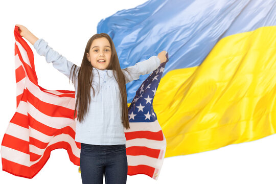 little girl with usa flag on the background of the Ukrainian flag