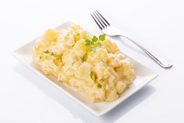 Tapa of aioli potatoes on white background