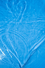 Blue waves ripples and splashes. Blue water texture. Selective focus