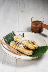 Pisang Gapit or pisang Epe is Grilled banana with coconut brown sugar sauce