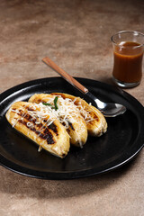 Pisang Gapit or pisang Epe is Grilled banana with coconut brown sugar sauce