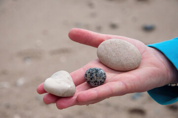 hands holding stones