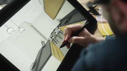 An experienced interior designer creates a digital sketch of a modern kitchen. A professional works with a digital graphics tablet.
