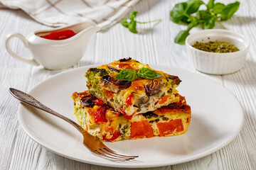 a portion of baked in oven vegetable frittata