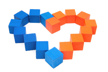 Heart symbol made from wooden cubes isolated