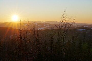 Sun set on Silesian Beskid near Bialy Krzyz in Szczyrk in Poland