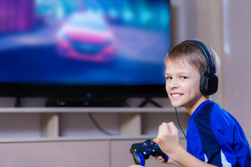 Young gamer playing online video games while streaming on social media. Blurred background and...