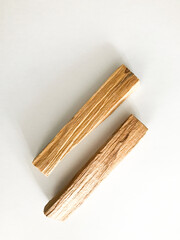 wooden palo santo sticks on a white background, incense set