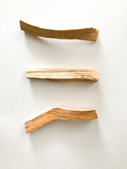 wooden palo santo sticks on a white background, incense set