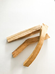 wooden palo santo sticks on a white background, incense set