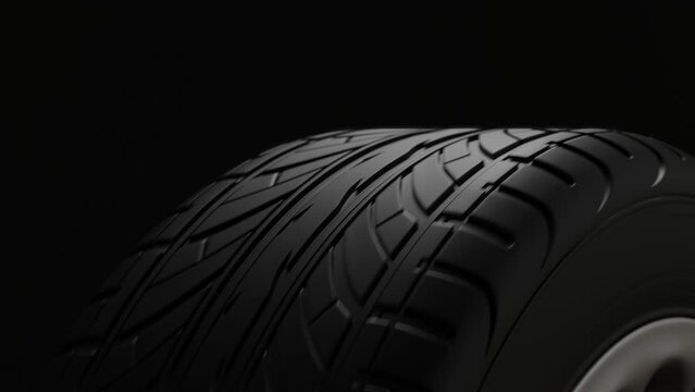 4K Animation. Close up perspective view on a black car tire in motion cyclic. 3d Render