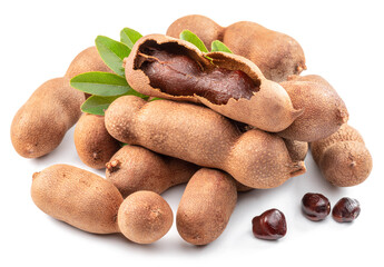 Ripe tamarind fruit, leaves and some tamarind seeds isolated on white background.